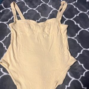 yellow bodysuit